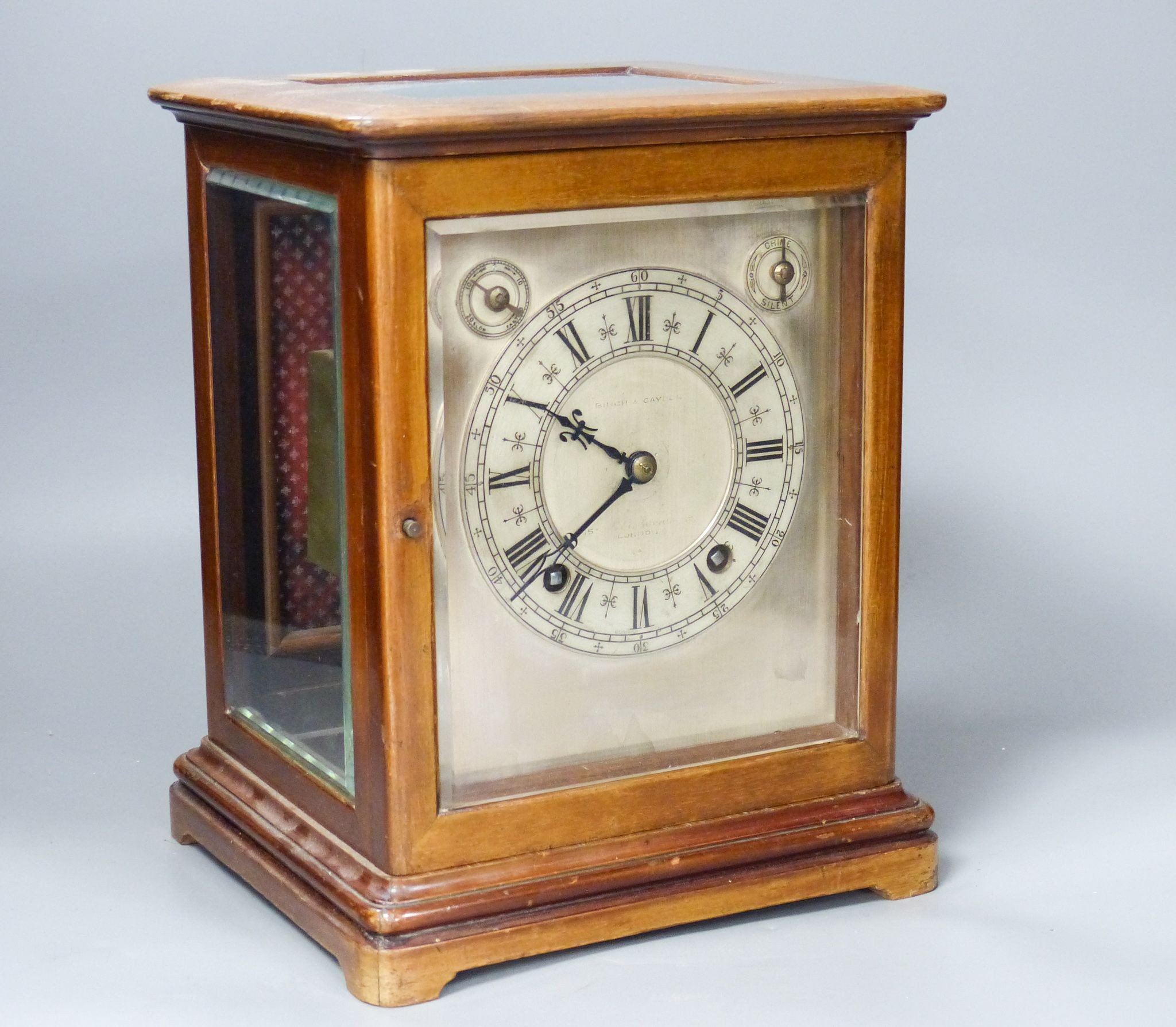 A chiming 4 glass mahogany mantel clock, retailed by Birch and Gaydon with silvered dial, 26.5 cm high 27cm